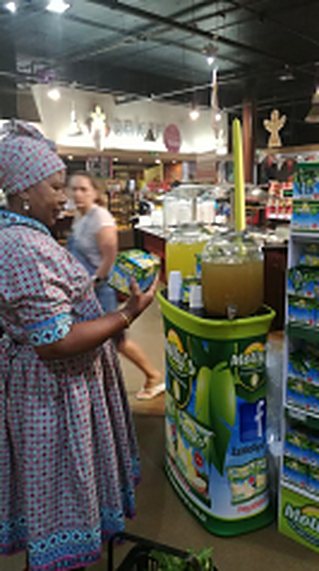 A shopper tasting Molly's at an in-store tasting station